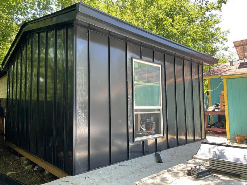 Black standing seam metal wall panels for Roof Inspection in Bixby